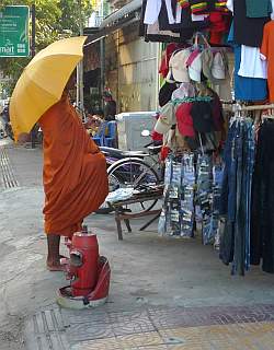 Monk making his daily begging rounds